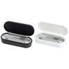A manicure set in black and white cases, containing various metal nail care tools. Each case is open and displays its contents.