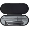 A black manicure set containing a nail clipper and two tools in a sleek, oval case.