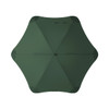 A green BLUNT Sport Umbrella with a unique octagonal shape and a central hub is displayed from above.