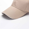 A beige cotton sandwich cap with a curved brim, featuring a logo on the front panel.