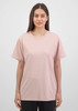 A women's short sleeve tee in soft pink, featuring a classic fit and a logo on the chest.
