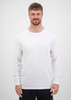 A man wearing a plain white long sleeve tee stands against a neutral background. The tee has a brand logo.