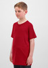 A red short sleeve tee for kids displayed on a child, featuring a simple design and a logo.
