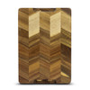 A wooden chopping board featuring a chevron pattern in various shades of brown. It has a logo on the surface.