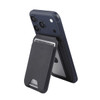 A navy magnetic wallet featuring a phone stand, holding a card and attached to a mobile device. Includes a logo.