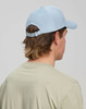A light blue Jacquard Texture 5 Panel Cap with an adjustable strap, viewed from the back on a person.
