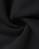A close-up of black fabric, showcasing a soft, fleecy texture, suitable for a kids' half zip collar sweat.