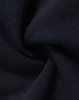 A close-up of navy fleece fabric showcasing its soft texture and smooth finish. The fabric has a subtle sheen.