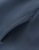 A close-up of a dark blue unisex premium fleece oversized hoodie, featuring a soft texture and seamless stitching.