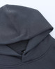 A grey unisex premium fleece oversized hoodie with a large hood, featuring a branding label.