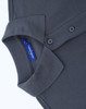 A grey short-sleeve polo shirt made of cotton and polyester, featuring a collar and button placket, with a logo.