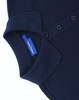 A navy blue polo shirt with a classic collar, featuring buttons and a tag inside.