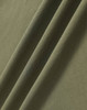 A close-up of olive green ultrafine cotton pique fabric, showcasing its texture and soft feel.
