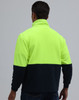 A full zip jacket featuring a high-visibility yellow upper and navy lower section, with a folded collar and branding.
