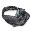 A custom elastic headband in a black and grey pattern with intricate designs and a versatile shape.
