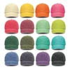 A collection of vintage washed caps in various colours, including yellow, orange, pink, green, blue, and purple, featuring logos.