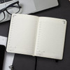A5 daily diary for 2027, featuring blank pages for each day, with a black cover and a ribbon bookmark.