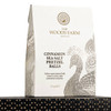 A bag of 100g cinnamon sea salt pretzel balls in a white and gold design, featuring a peacock motif.