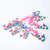 A set of colourful stickers featuring flowers and butterflies, all with a playful design on a white background.
