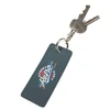 A blue rectangle keychain with a branding logo, holding several keys attached to a metal keyring.