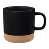 A ceramic coffee mug featuring a black upper portion with speckles and a matte tan bottom. It has a comfortable handle and a logo.