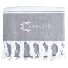 A grey towel with white fringe detailing and a logo printed on it.