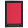 A red journal and pen gift set displayed in a black box with a foam insert. The box includes a logo.