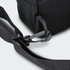 A black crossbody bag featuring a mesh panel and a secure clip on the strap. It has a simple, functional design.