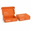 An orange custom box with a locking lid, featuring an open and closed position. The box has a logo.