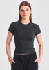 A fitted women's baby tee in dark green with short sleeves, paired with black shorts. It features a subtle logo.