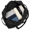 A black duffel bag with neatly packed clothing, headphones, and a book, showcasing its spacious interior.