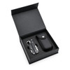 A black multi-tool and its carrying case inside a black box. The tool features various metallic attachments.