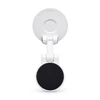 A white phone holder with a black magnetic base and a suction cup for mounting. It features a logo on the back.