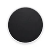 A round phone holder featuring a white rim and a black centre. It has a smooth surface and a subtle logo.