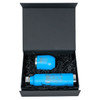 A blue drink bottle and cup are displayed inside a black magnetic gift box, surrounded by black shredded paper.