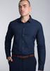 A fitted long sleeve shirt in navy blue, featuring a button-up front and a sleek collar, worn by a model.