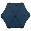 A dark blue BLUNT Classic Umbrella with a unique star-shaped canopy design and a central opening.