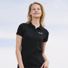 A black women's polo shirt featuring a logo. The polo has a classic collar and short sleeves.