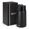 A drink bottle in matte black with a sleek design, alongside a black boxed packaging. It features a logo.