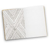 A mindfulness notebook featuring a patterned design on the left page and lined pages on the right. It has a simple cover.