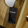 A wooden folding wine table with a natural finish, featuring a tag with a logo.