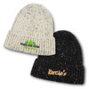A snowflake beanie, featuring a cream and black colour scheme, with logos on the front of each hat.