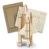A wooden model of a rocket ship in natural wood tones, accompanied by a cardboard packaging with design instructions.