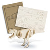 A wooden model of a Tyrannosaurus Rex in natural wood colour, accompanied by assembly instructions on a brown card.