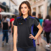 A woman models a black and purple polo shirt with a logo. The background features a busy street scene.