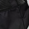 A black sports tote with a mesh design and sturdy straps, featuring a logo on the material.