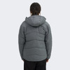 A grey women's puffer jacket with a hood, featuring a quilted design and a logo on the back.