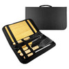 A BBQ set featuring stainless steel tools with wooden handles and a black carrying case. Includes spatula, tongs, and knife.