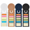 A set of four notepads in white, kraft, navy, and black, each with various sticky note colours and a ruler.