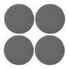 A set of four round slate coasters in dark grey, featuring a textured edge.